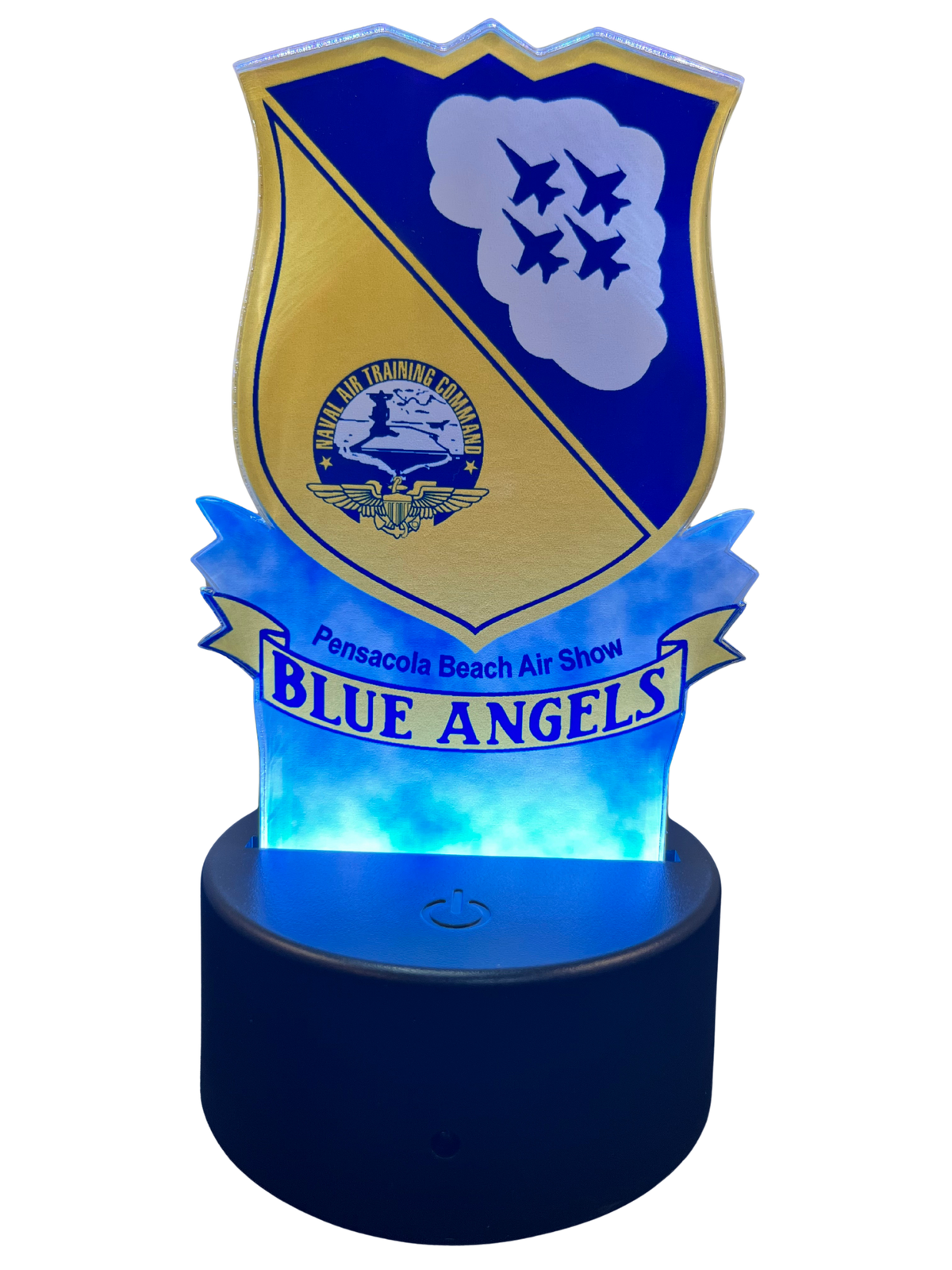 A blue and gold LED night light shaped like a military-style crest with the words 'Pensacola Beach Air Show BLUE ANGELS' on a glowing blue base.